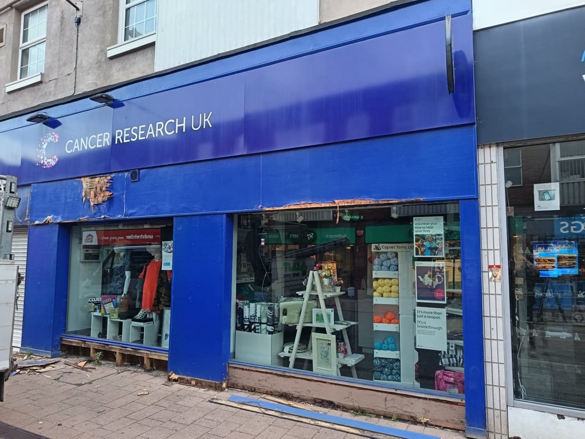 Before: a tired commercial shop front in Nottingham with worn signage and paintwork